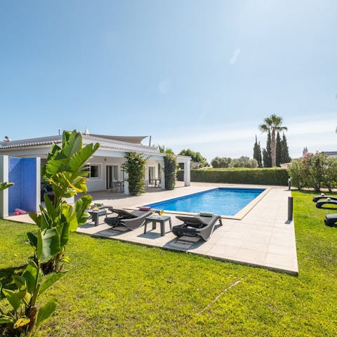 Unwind on the sunny pool terrace after going out to explore the Algarve