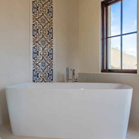 Treat yourself to a relaxing bath in the master tub