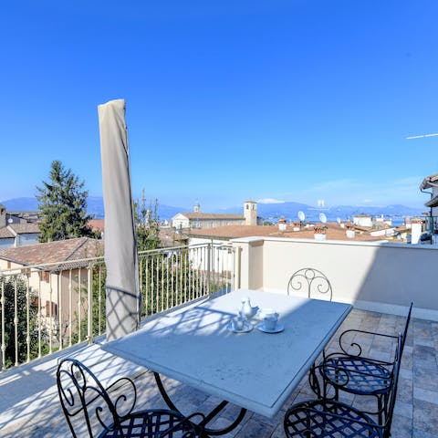 Share bruschetta and a bottle of Italian vino alfresco on the balcony