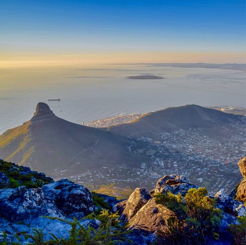 Stand afoot the iconic Table Mountain, just a scenic ten-minute drive away