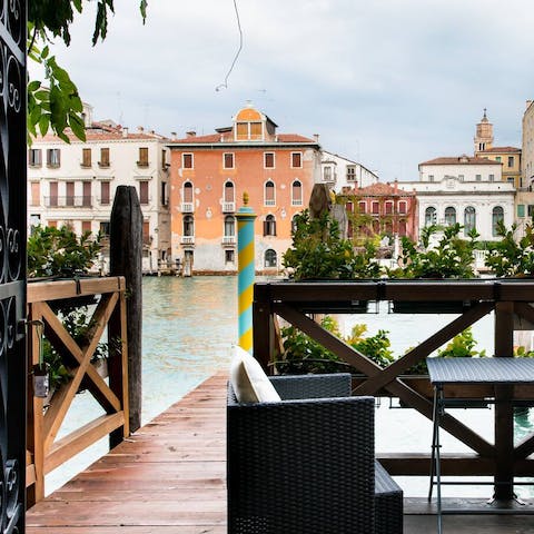 Sip your morning coffee beside the Grand Canal