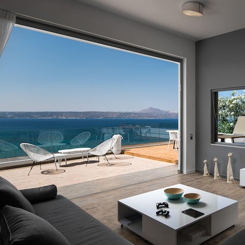 Gaze out at sweeping views from the vast terrace by the glass-fronted living space