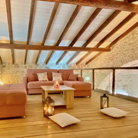 Relax on your soft chaise sofa with wooden beams stretching out above you