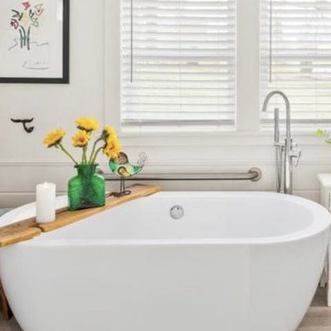 Treat yourself to a long soak in the luxurious tub 