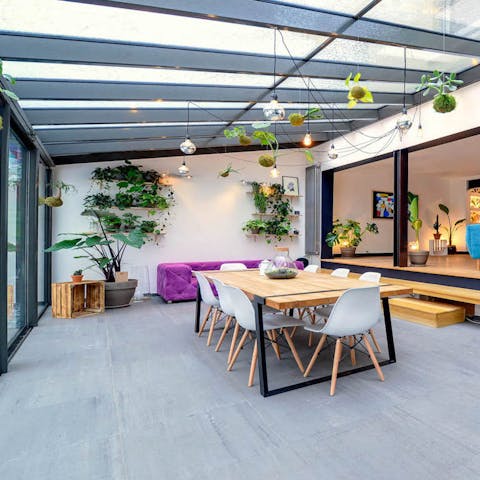 the tranquil glass roofed dining space 
