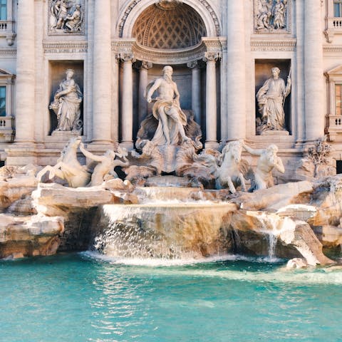 Make a wish by the Trevi Fountain, a fifteen-minute walk away