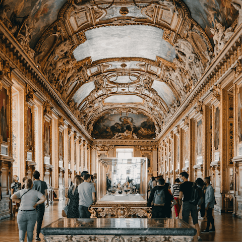 Admire the artwork in the Louvre, a fifteen-minute walk away