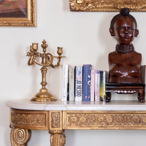 Admire the well-curated antiques furnishings and trinkets