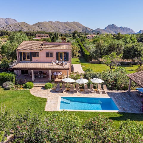 Soak up the views of the coast and mountains from the bedroom's balcony