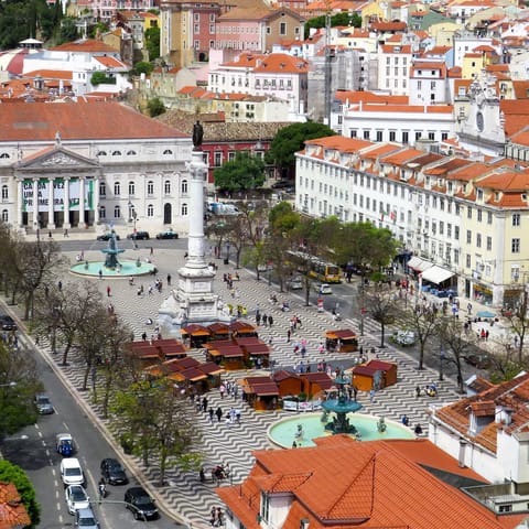 Pick up a pastel de nata at Rossio Square – a sixteen-minute metro ride away