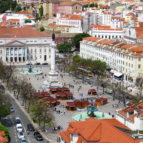 Pick up a pastel de nata at Rossio Square – a sixteen-minute metro ride away