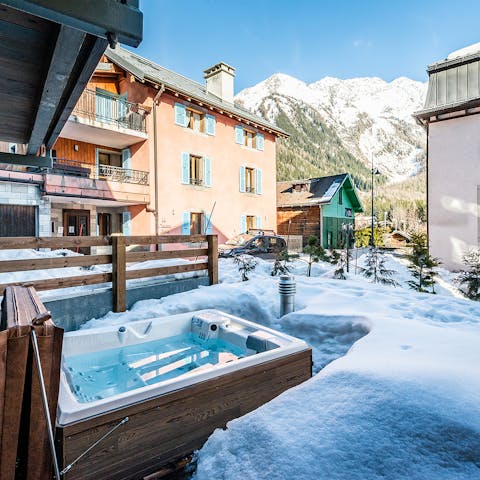 Unwind in the private jacuzzi surrounded by snowfall 