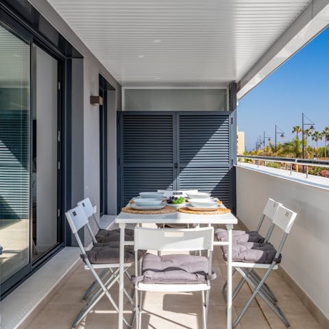 Gather together for shaded alfresco meals on the private balcony