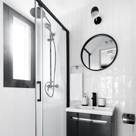 Start mornings with a relaxing soak under the bathroom's rainfall shower