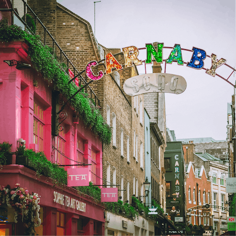 Walk out onto the crowds of Carnaby Street and the bars and restaurants of Soho, mere minutes away