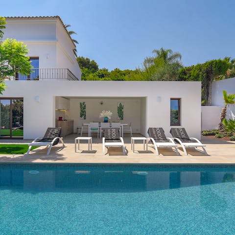 Lie back and catch some sun after a swim in the private pool