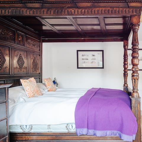 Drift off to sleep in the grand, four-poster bed