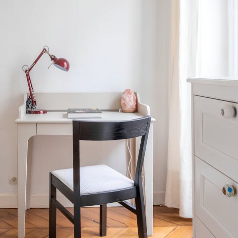 Catch up on work at the bedroom's useful desk space