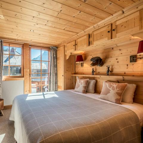 Wake up in your cosy cabin bedroom ready for another day of alpine skiing