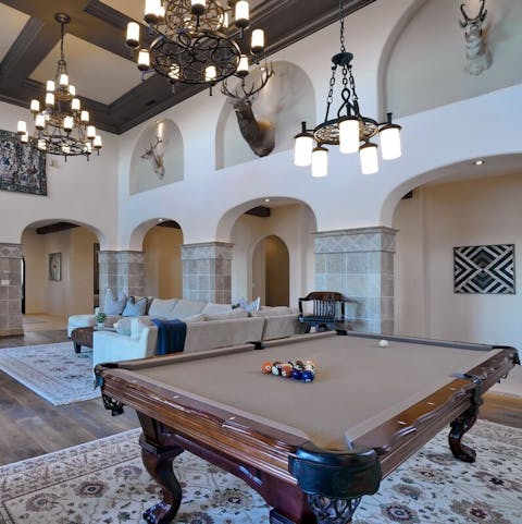Play pool in the grand family room
