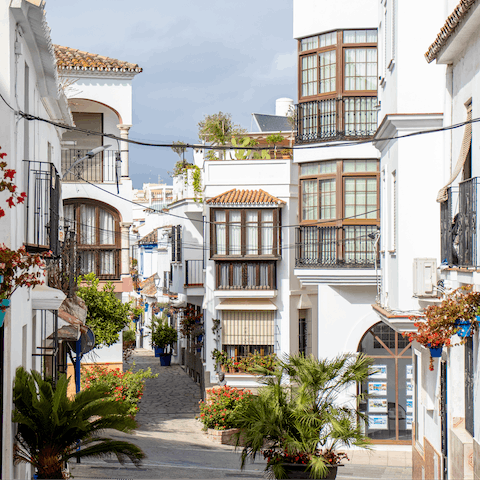 Take a stroll through the charming town of Estepona