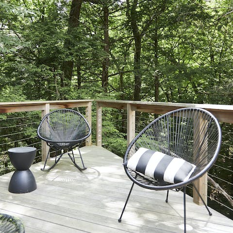 Sit out on the deck, perched above Raybrook Creek