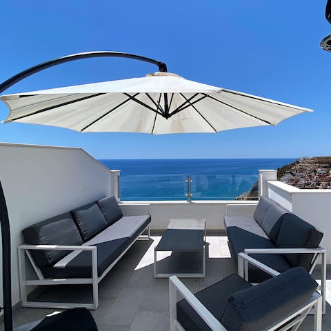 Relax under the shade of the parasol with outdoor seating on one of three sun terraces