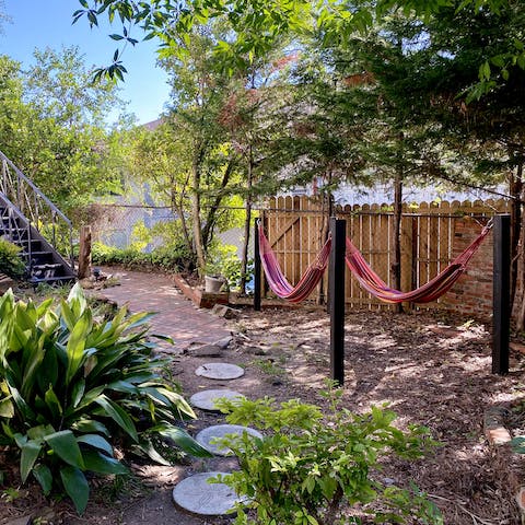 Cuddle up in one of the oversized hammocks under the sun or the stars