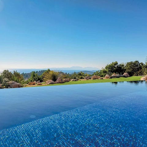 Take a dip in the private swimming pool overlooking the ocean 
