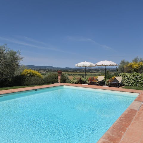 Soak up the Tuscan rays from the private pool and loungers