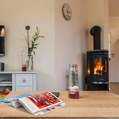 Snuggle up by the wood-burning fire with a good book and a glass of wine on cooler evenings