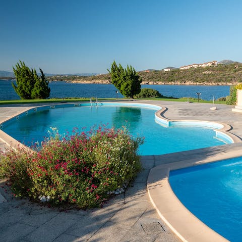Go for a dip in the large communal pools by the sea