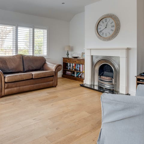 Admire the feature fireplace, giving the living room a cosy feel