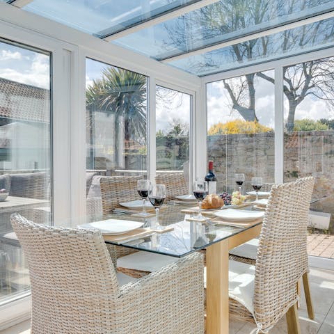 Enjoy a drink or breakfast in the sun-filled conservatory