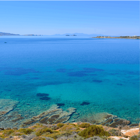 Discover Paros' crystal shoreline at Chryssi Akti, a short drive away