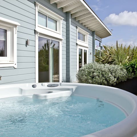 Treat yourself to a dip in the hot tub on your private terrace
