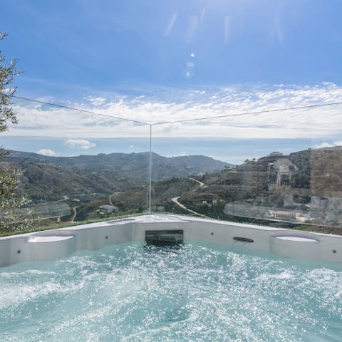 Sit back in the sunken hot tub and watch the sun disappear beneath the horizon