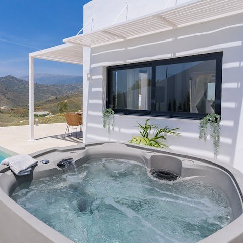 Unwind as you sit back in the hot tub surrounded by tranquillity
