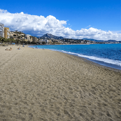 Spend the day in the soft sand of Torrox Beach, a short drive away