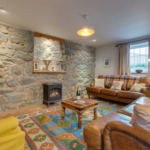 Cosy up around the wood-burning stove in the living room