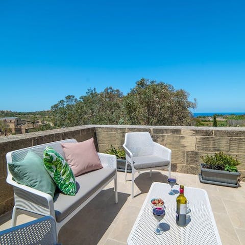 Relax with a glass of wine on the balcony