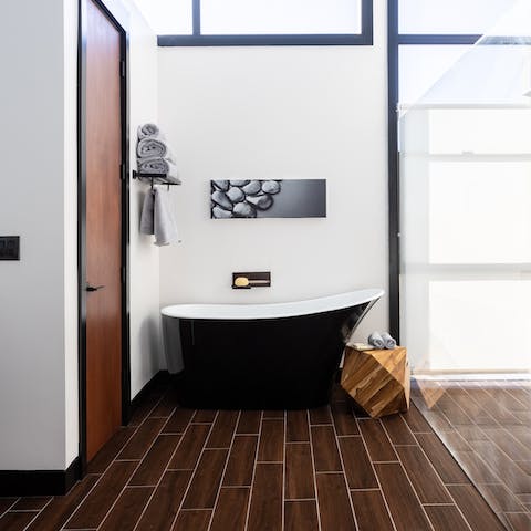 Unwind in the deep freestanding bathtub 