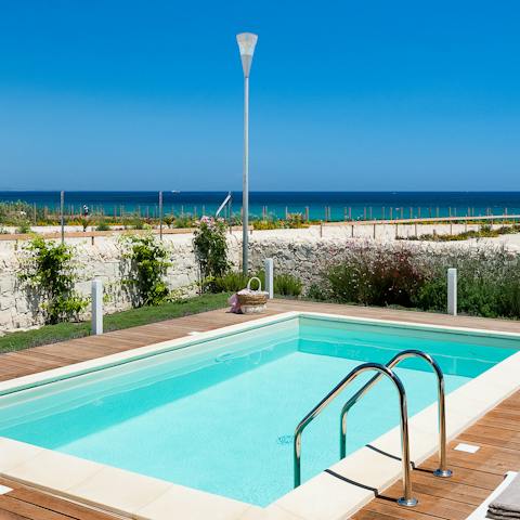 Cool off in the refreshing swimming pool with a sea view