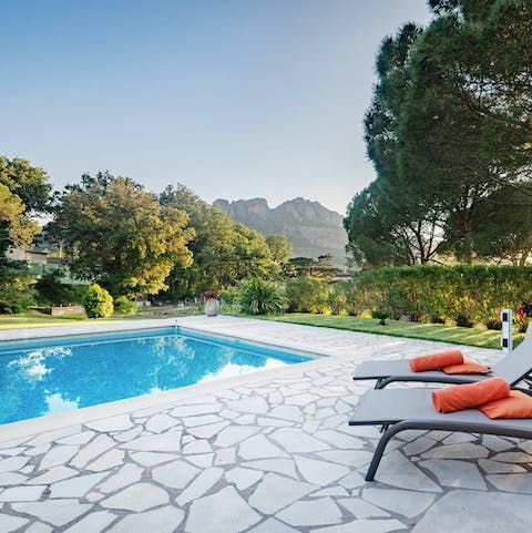 Enjoy beautiful views across Roquebrune while lounging by the pool