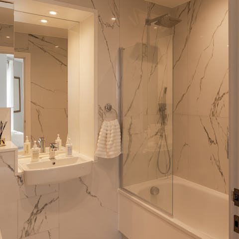 Get ready for a night out in London in the marble-clad bathroom