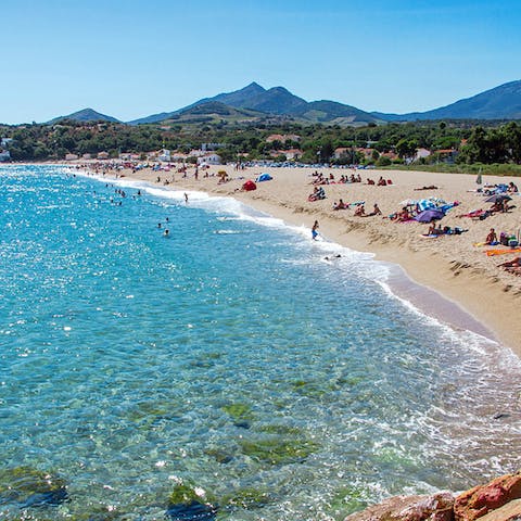 Visit the stunning beach of Le Racou, with golden sand, clear water and a dramatic backdrop