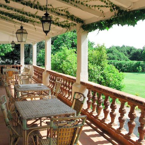 Gaze across the immaculately green gardens from your terrace