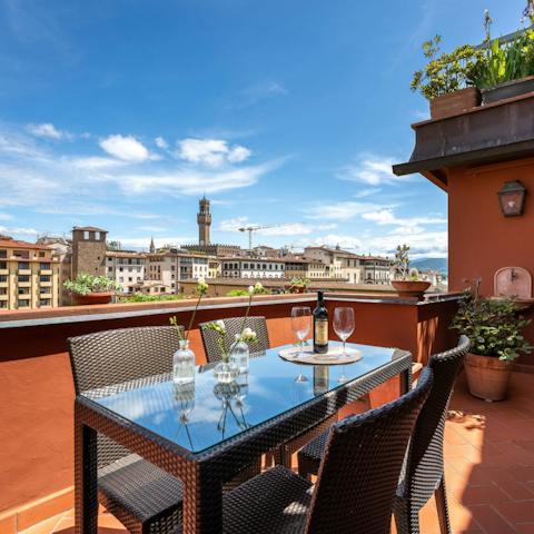 Dine alfresco on one of the two terraces, with views of the river Arno