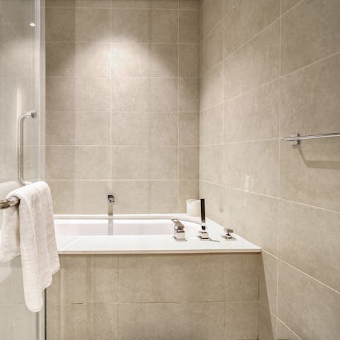 Unwind in the bathtub after a fun-filled day of taking in Dubai's sights
