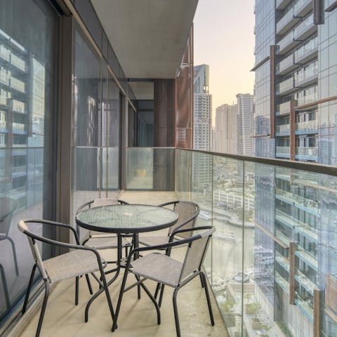 Enjoy an aperitif with a view over the city's skyline from the balcony